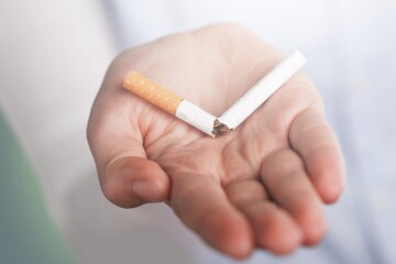Stop smoking concept, Hand with broken cigarette