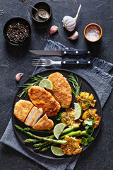 fried chicken breasts with asparagus and potatoes
