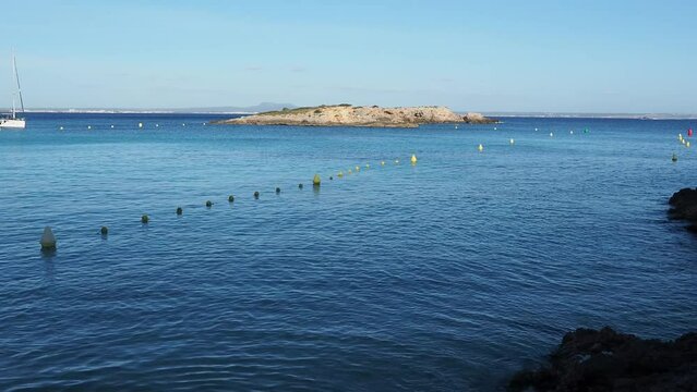 View of the blue sea and the "island of La Caleta" in front of Illetas in Mallorca