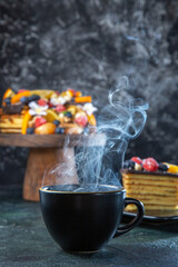 front view delicious fruit cake with cup of tea dark background tea pie dessert sweet biscuit cakes sugar dough