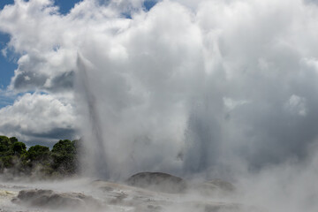 Fototapeta na wymiar Pohutu Geyser in the Whakarewarewa Thermal Valley, Rotorua, in the North Island of New Zealand. The geyser is the largest in the southern hemisphere and among the most active in the area