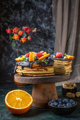 front view yummy chocolate cake with fruits on dark background biscuit dough dessert sugar pie sweet