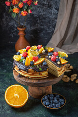 front view yummy chocolate cake with fruits on dark background biscuits dough dessert sugar cake pie sweet