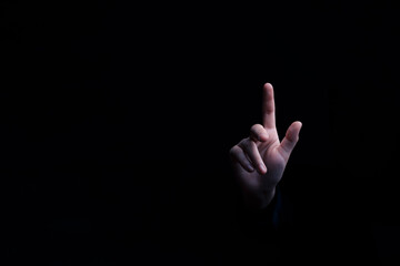 Discover the power of determination and leadership with our captivating photograph of a businessman's hand pointing to an empty space on a sleek black background. Achieve success, inspire innovation.