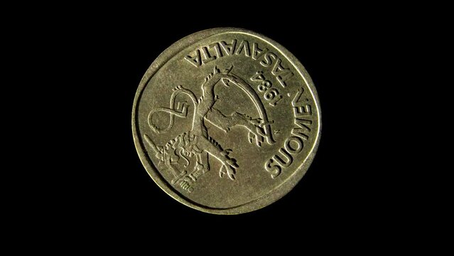 Obverse of Finland old coin 1 markka 1984 isolated in black background. 4k video