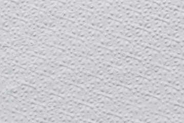 A sheet of white structured white tissue paper as background
