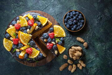 top view yummy chocolate cake with fruits on dark background biscuit dessert sugar cake pies dough sweet tea © Kamran