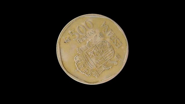 Reverse of Spain coin 500 pesetas isolated in black background. 4k video