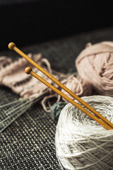 Closeup of woolen threads and knitting needles