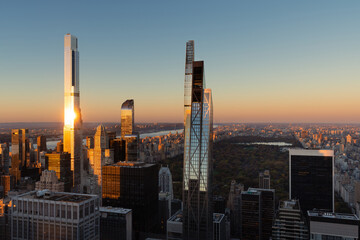 Aerial view of supertall buildings and skyscrapers of Billionaires Row in Midtown Manhattan at sunset. New York City - 596326055