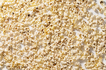 Closeup of scattered popcorn with hard lighting
