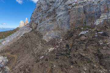 Contact between Triassic volcanic dike and light carbonate rocks of biological origin along the path that goes up to the Latemar. UNESCO world heritage site, Trentino-Alto Adige, Italy, Europe