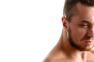 Obraz premium Young handsome trainer posing in the studio. A man with a beautiful athletic body.