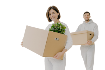 Happy young couple enter own modern house, buy real estate, carry cardboard boxes with indoor plant and other personal stuff, buy new house for living, have moving day. People and property concept