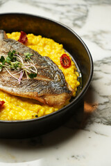 Fried fish and sweet corn with baked tomato