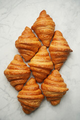 Fresh croissant background, close-up.