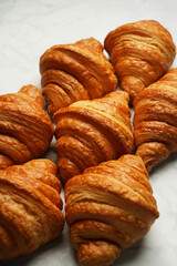 Fresh croissant background, close-up.