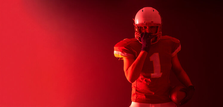 American football player. Download high resolution photo for sports design. Horizontal banner in neon colors. Mockup for betting advertisement.