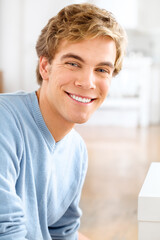 Spending some quality time by myself. Shot of a young man relaxing at home.