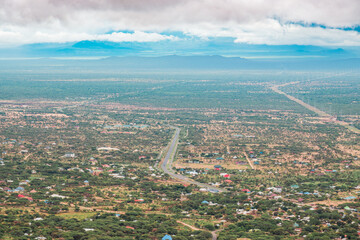 Aerial view of Longido Township against the background of Mount Meru in Tanzania