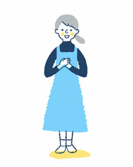 手を胸に当てて立っている笑顔の若い女性