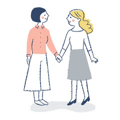 見つめ合って手を繋ぐ若い女性2人
