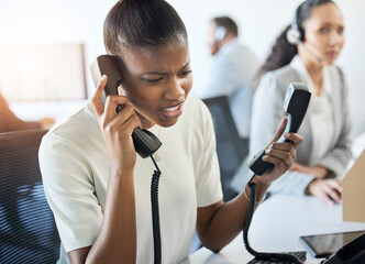 Shes a little busy at the moment. Cropped shot of an attractive young female call center agent...