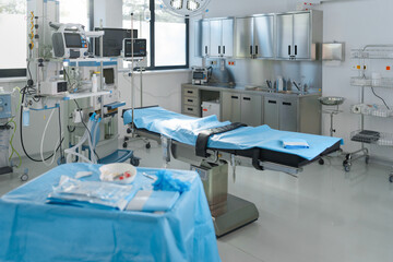Close-up of empty surgical room with bed.