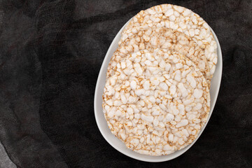 Few crunchy rice cakes on white dish