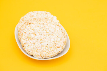 Few crunchy rice cakes on white dish