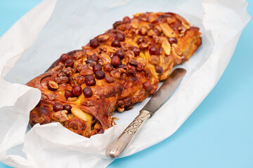 cake with dry fruits and canned sugar on paper