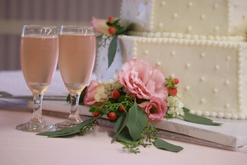 wedding bouquet with champagne, cake and flowers