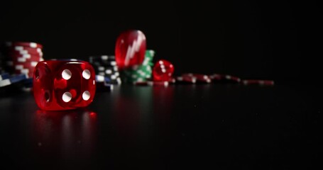 Closeup of falling red dice and casino chips on black background. Gambling and entertainment concept poker and gambling - Powered by Adobe