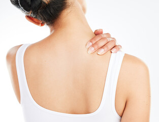 What hurts us is what heals us. Studio shot of an unrecognizable woman experiencing back pain after working out against a white background.