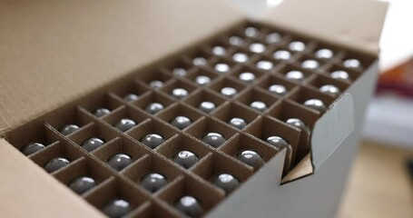 Glass medical jars for vaccines in a cardboard box. Glass products packaging background