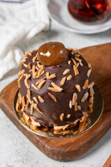 Chestnut and chocolate cake. Delicious cake with cream filling. Studio shoot. Bakery products. Close up