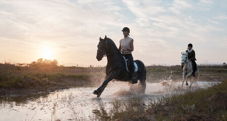 Its always a good day when were out horse riding. Shot of two young women out horseback riding...