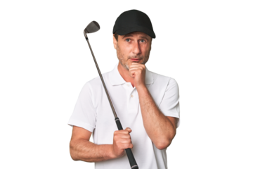 Middle aged golfer man looking sideways with doubtful and skeptical expression.
