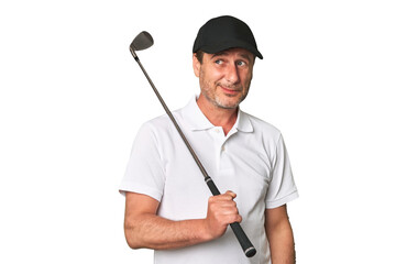 Middle aged golfer man dreaming of achieving goals and purposes