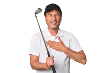 Middle aged golfer man laughs out loudly keeping hand on chest.