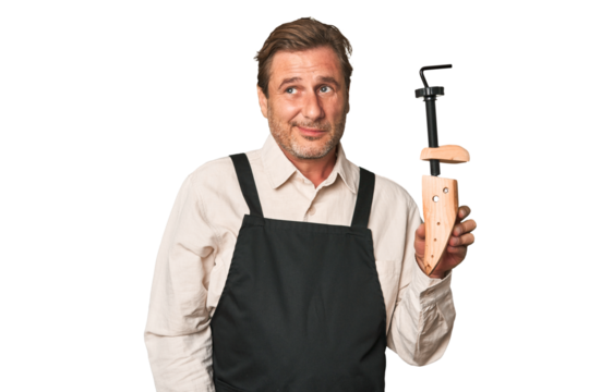 A middle-aged shoe maker dreaming of achieving goals and purposes