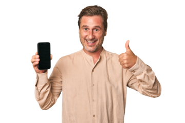 A middle-aged man showing the display of his phone to promote something