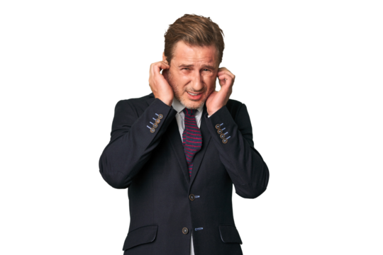 A middle-aged businessman isolated covering ears with hands.