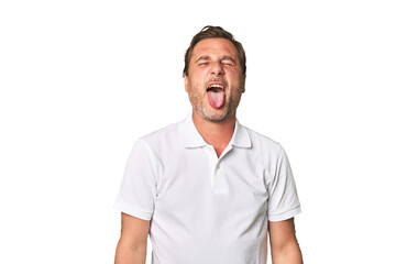 A middle-aged man isolated funny and friendly sticking out tongue.