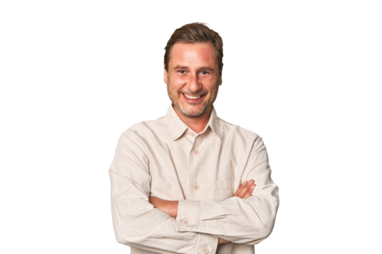 A middle-aged man isolated who feels confident, crossing arms with determination.