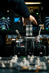 Fototapeta na wymiar An airplane pilot controls the throttle during flight or takeoff View from inside the cabin