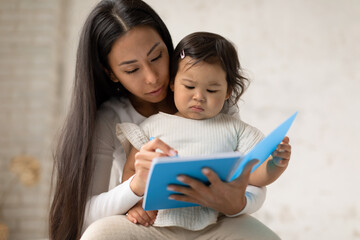 Japanese Mommy And Infant Daughter Drawing In Notebook At Home