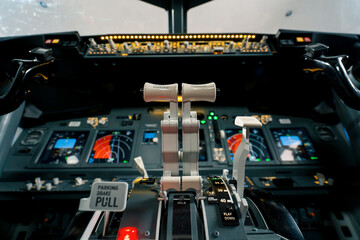 thrust lever in the cockpit of an airplane a close-up view of a flight on an aircraft simulator