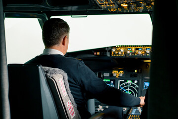 pilot pressing the gas pedal in the cockpit of a jet plane during a flight or flight simulator...