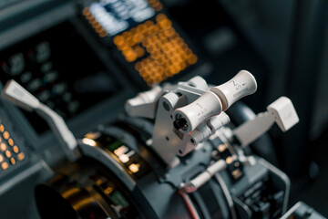 pilot's gas lever in the airplane cockpit close-up flight details flight simulator